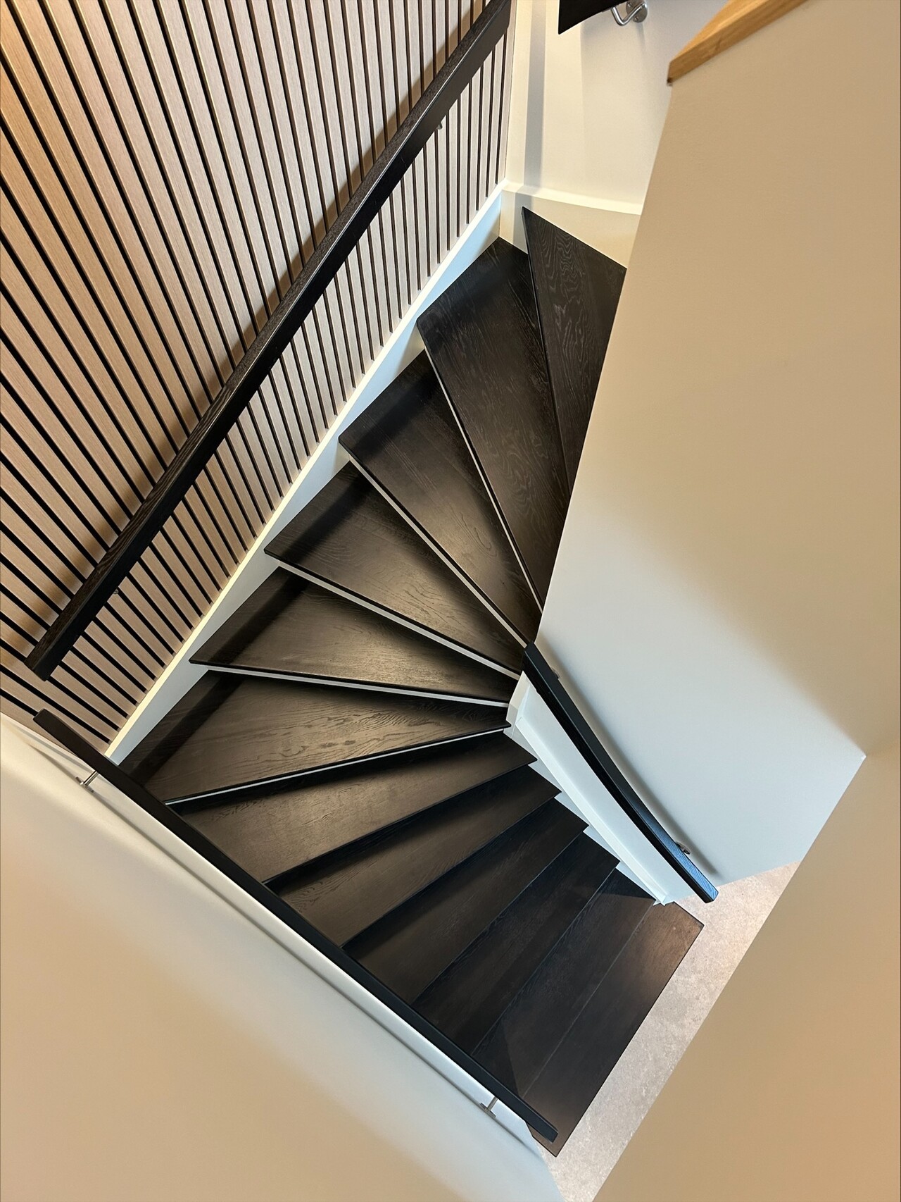 U-shaped staircase made of oak stained black